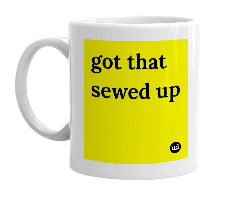 White mug with 'got that sewed up' in bold black letters