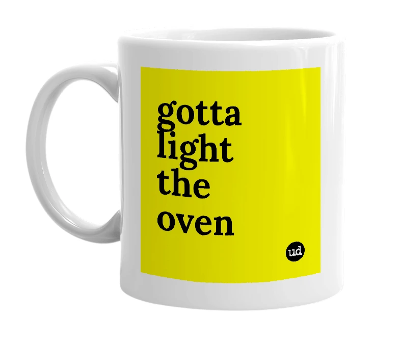 White mug with 'gotta light the oven' in bold black letters