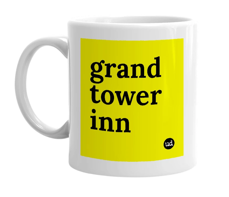 White mug with 'grand tower inn' in bold black letters