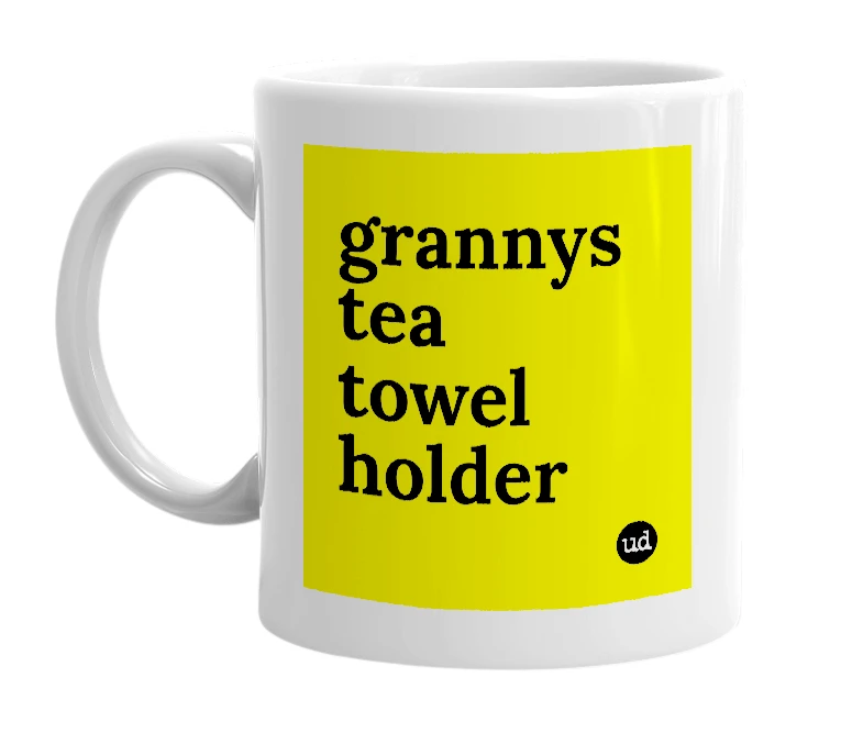 White mug with 'grannys tea towel holder' in bold black letters