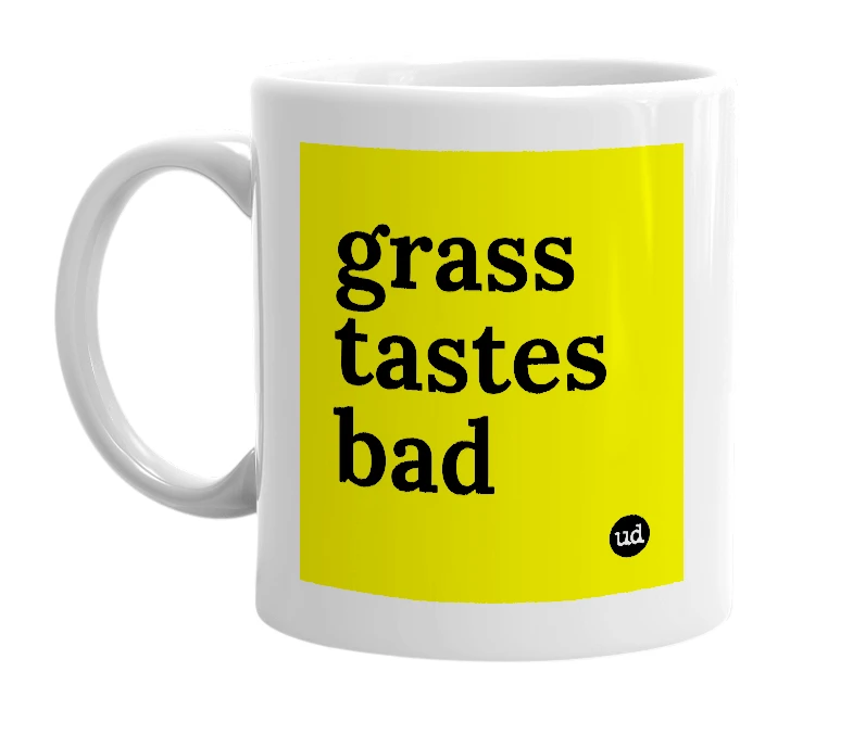 White mug with 'grass tastes bad' in bold black letters