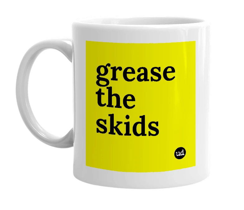 White mug with 'grease the skids' in bold black letters