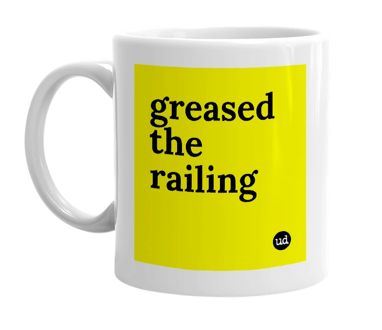 White mug with 'greased the railing' in bold black letters