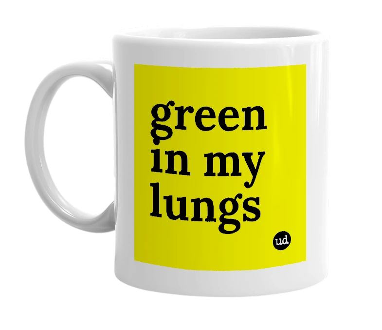 White mug with 'green in my lungs' in bold black letters