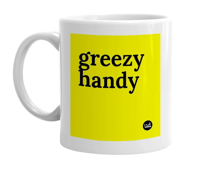 White mug with 'greezy handy' in bold black letters