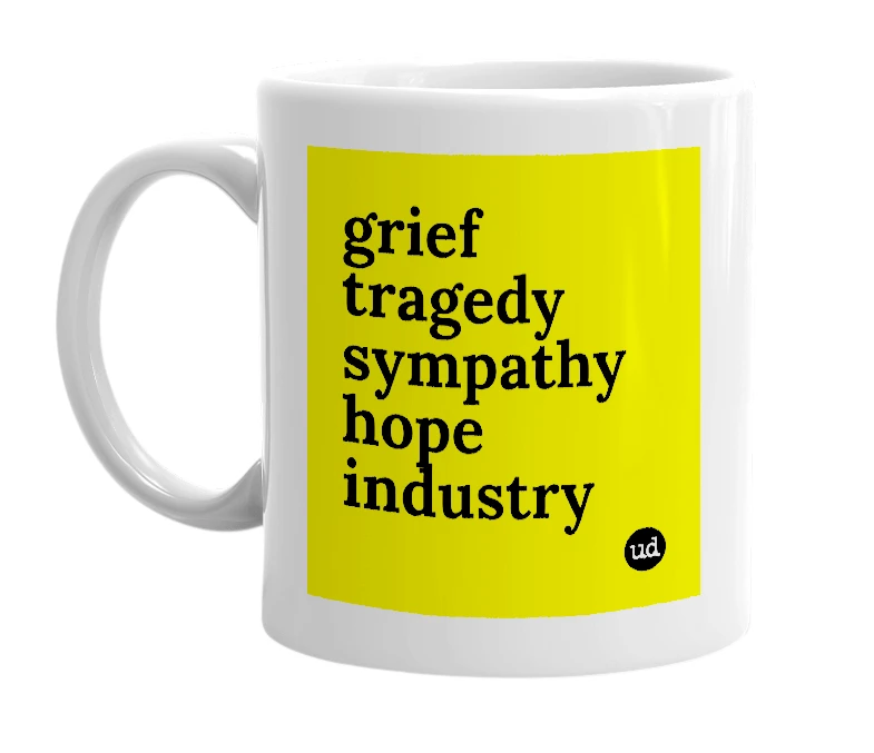 White mug with 'grief tragedy sympathy hope industry' in bold black letters