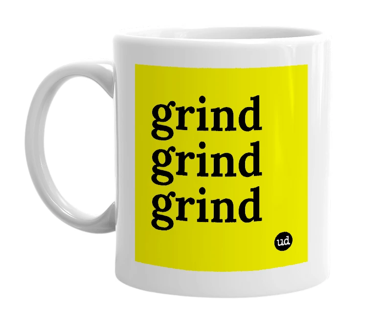 White mug with 'grind grind grind' in bold black letters