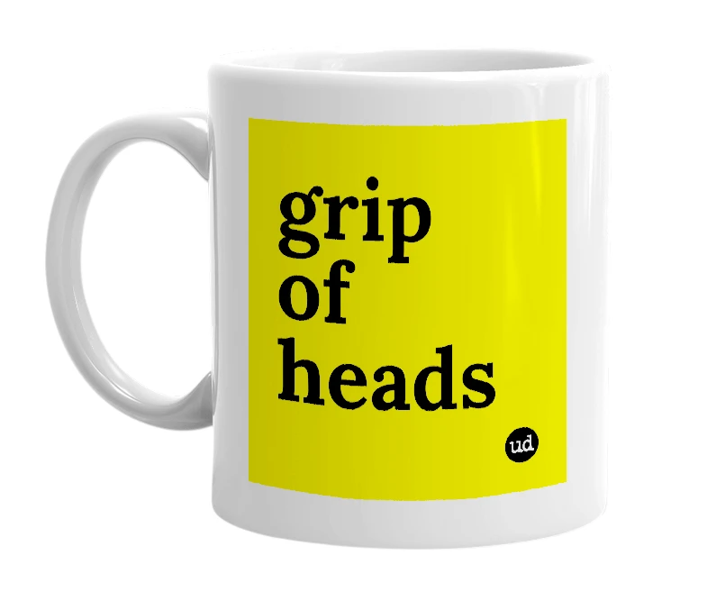 White mug with 'grip of heads' in bold black letters