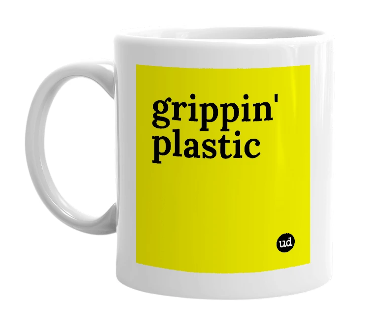 White mug with 'grippin' plastic' in bold black letters