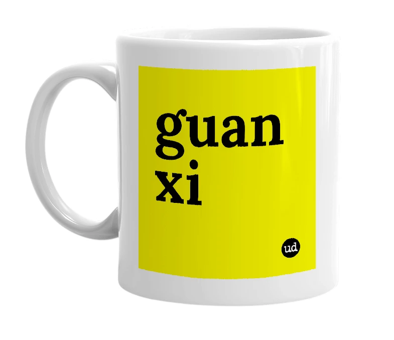 White mug with 'guan xi' in bold black letters