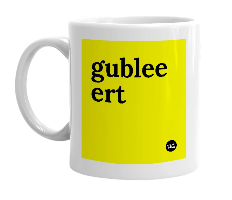 White mug with 'gublee ert' in bold black letters