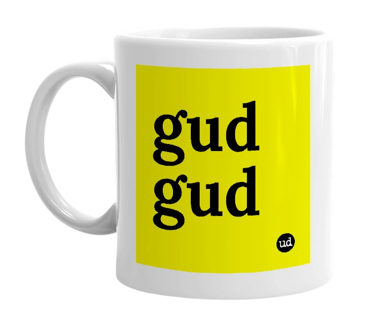 White mug with 'gud gud' in bold black letters