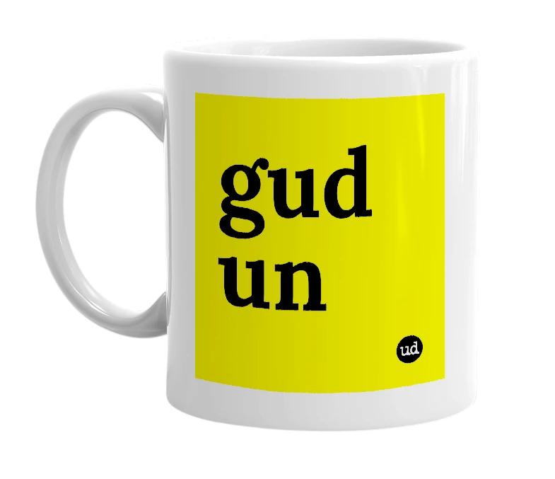 White mug with 'gud un' in bold black letters