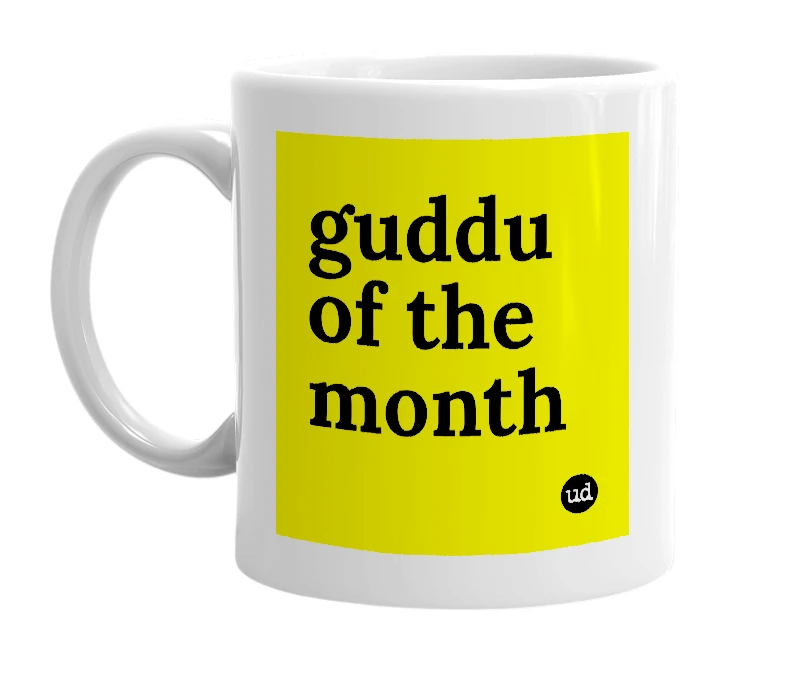White mug with 'guddu of the month' in bold black letters