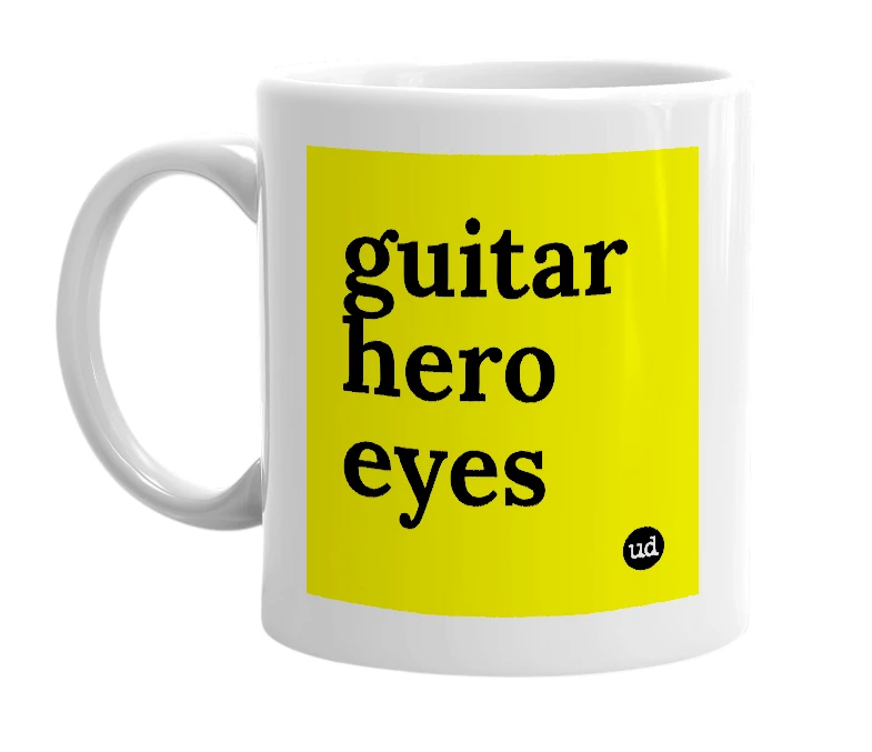 White mug with 'guitar hero eyes' in bold black letters