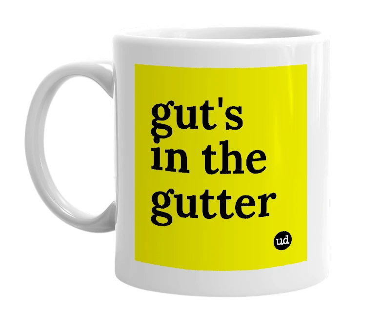 White mug with 'gut's in the gutter' in bold black letters