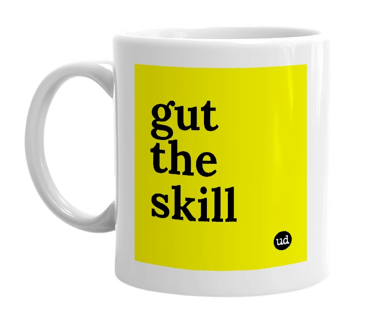 White mug with 'gut the skill' in bold black letters