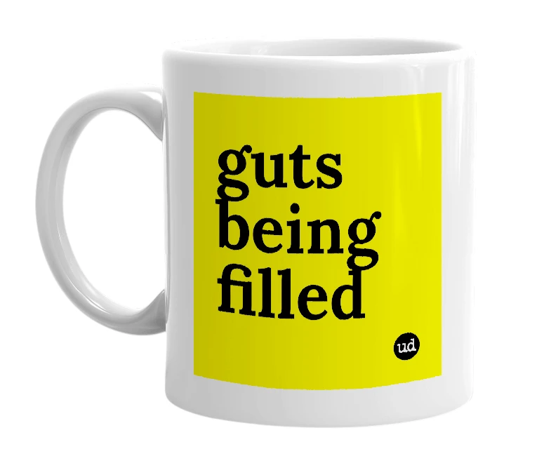 White mug with 'guts being filled' in bold black letters