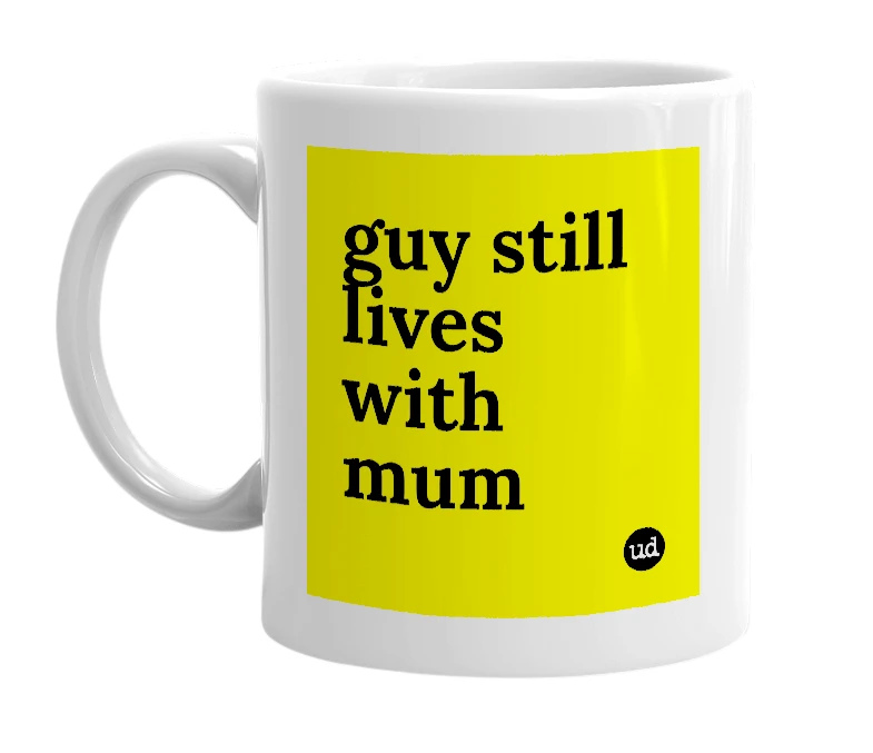 White mug with 'guy still lives with mum' in bold black letters