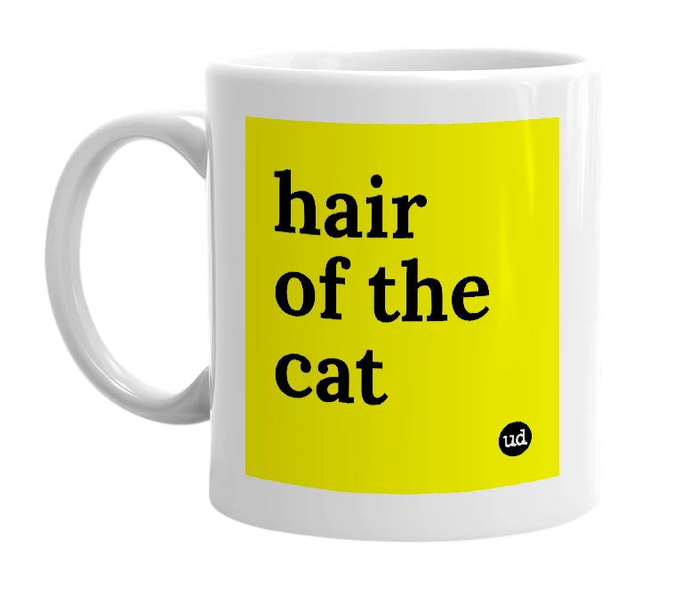 White mug with 'hair of the cat' in bold black letters