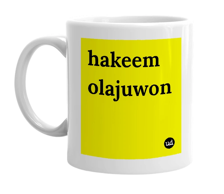 White mug with 'hakeem olajuwon' in bold black letters