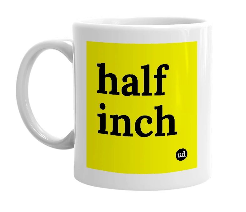 White mug with 'half inch' in bold black letters