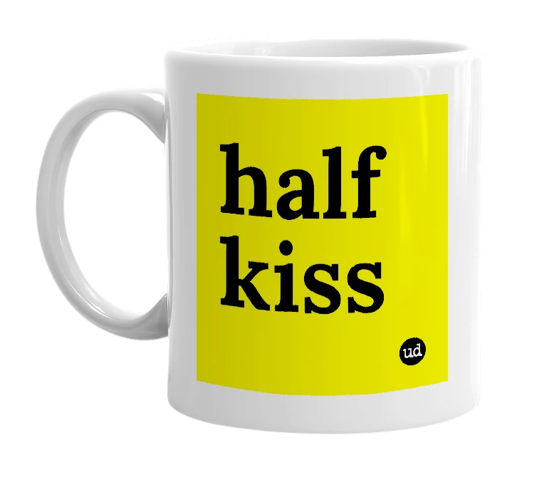 White mug with 'half kiss' in bold black letters