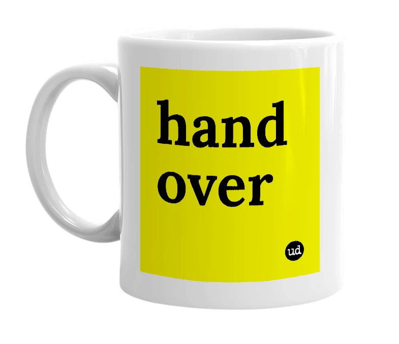 White mug with 'hand over' in bold black letters