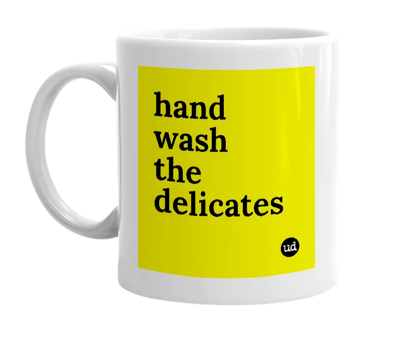 White mug with 'hand wash the delicates' in bold black letters