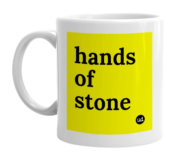 White mug with 'hands of stone' in bold black letters