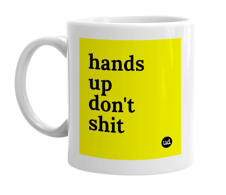 White mug with 'hands up don't shit' in bold black letters