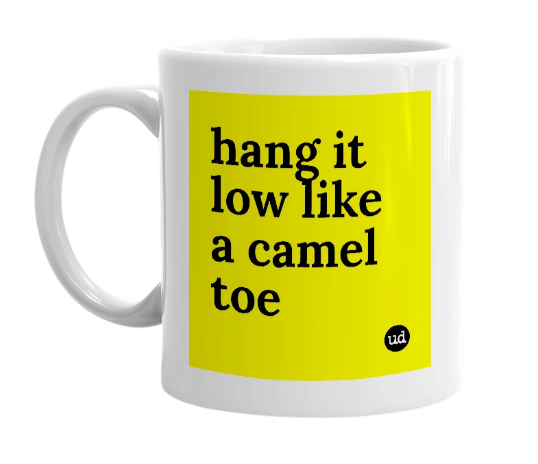 White mug with 'hang it low like a camel toe' in bold black letters