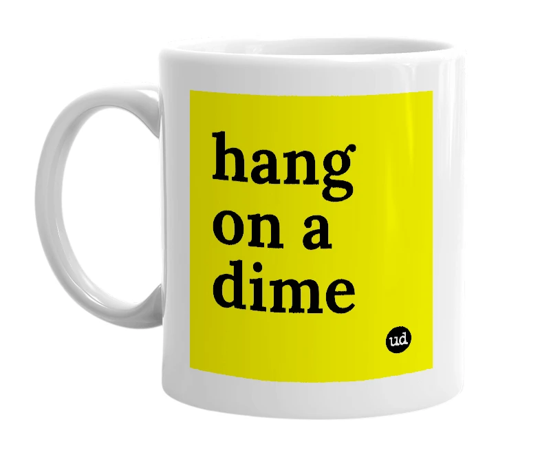 White mug with 'hang on a dime' in bold black letters