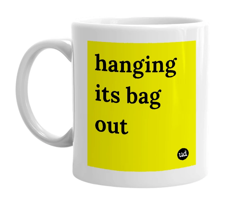 White mug with 'hanging its bag out' in bold black letters