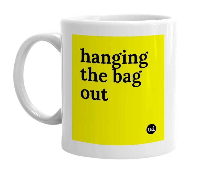 White mug with 'hanging the bag out' in bold black letters