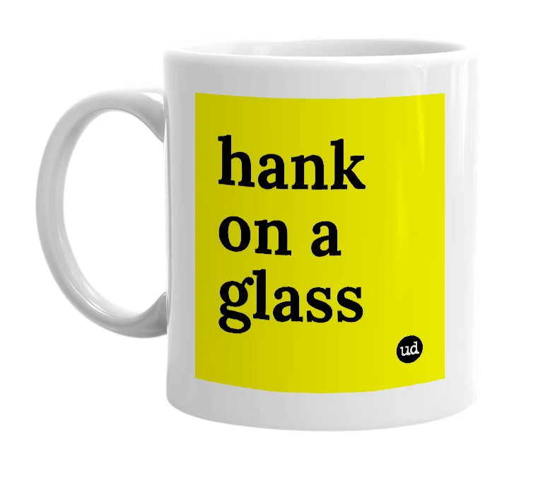 White mug with 'hank on a glass' in bold black letters