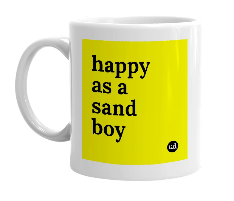 White mug with 'happy as a sand boy' in bold black letters