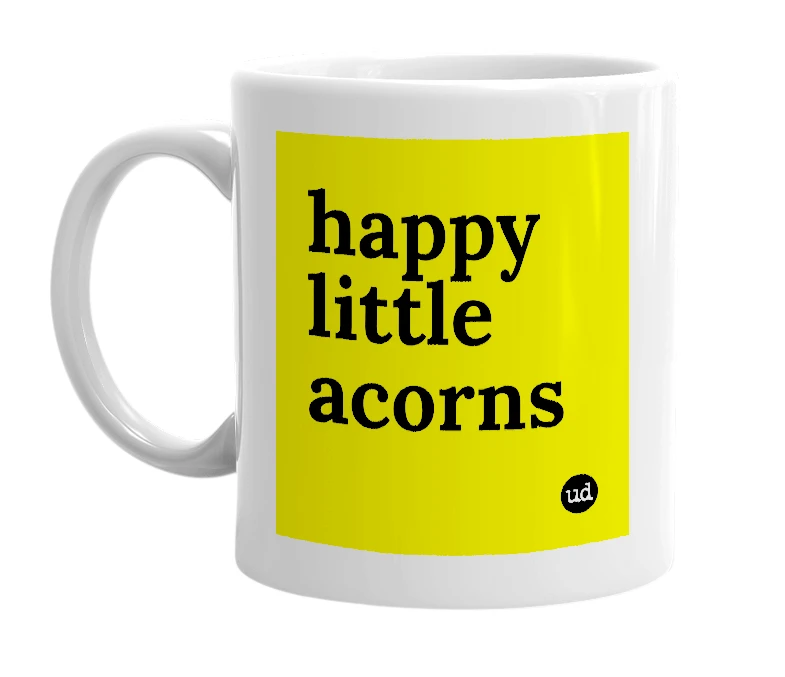 White mug with 'happy little acorns' in bold black letters