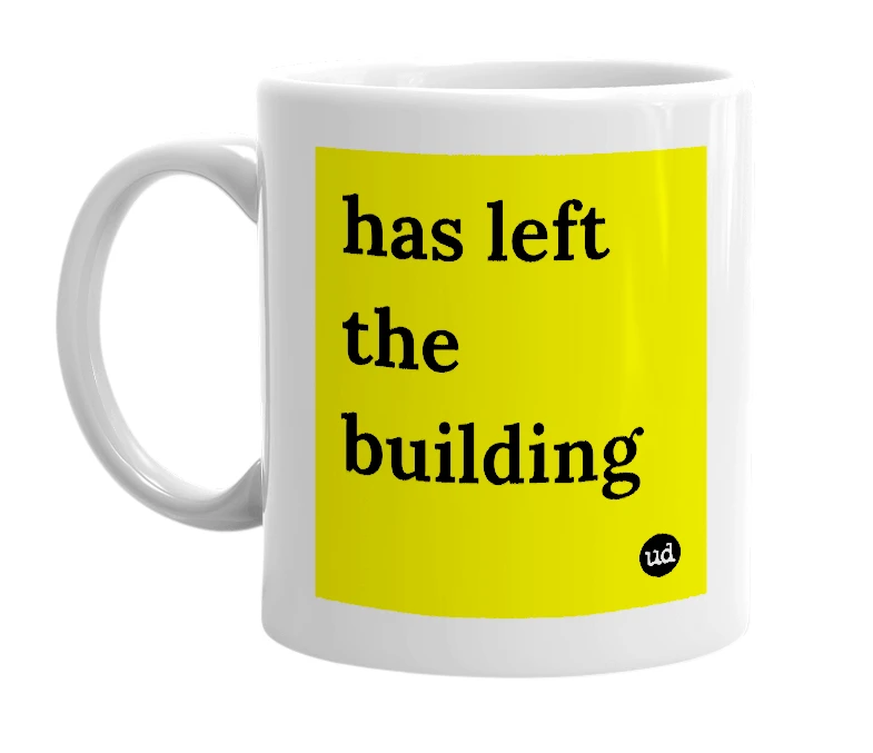 White mug with 'has left the building' in bold black letters