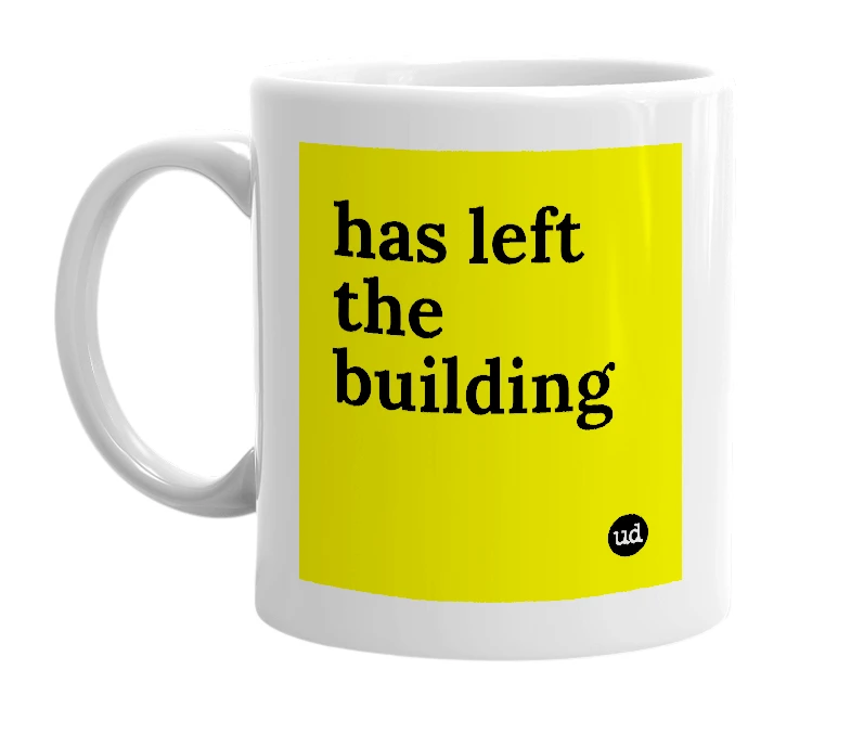 White mug with 'has left the building' in bold black letters