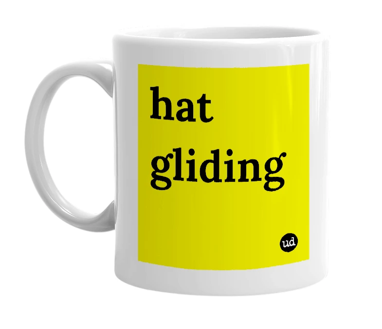 White mug with 'hat gliding' in bold black letters