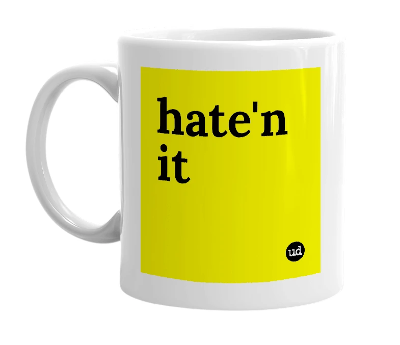 White mug with 'hate'n it' in bold black letters