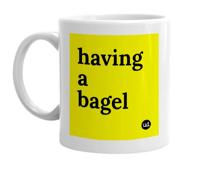 White mug with 'having a bagel' in bold black letters