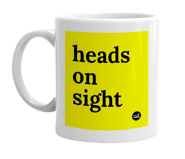 White mug with 'heads on sight' in bold black letters