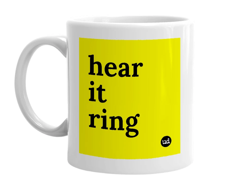 White mug with 'hear it ring' in bold black letters