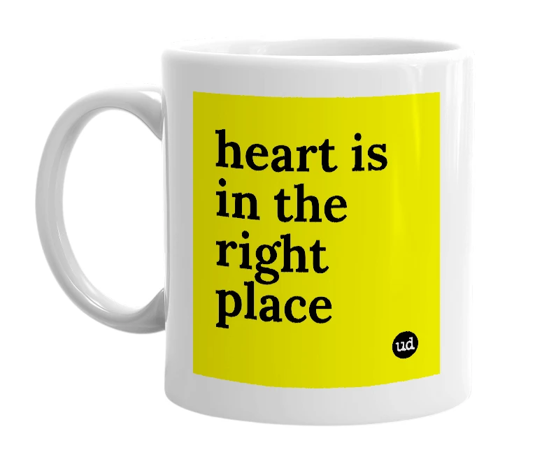 White mug with 'heart is in the right place' in bold black letters
