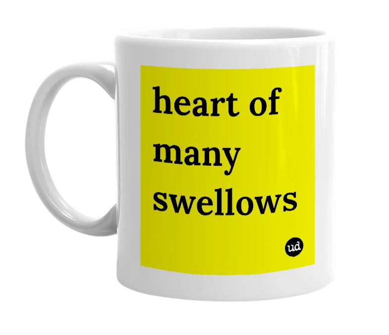 White mug with 'heart of many swellows' in bold black letters