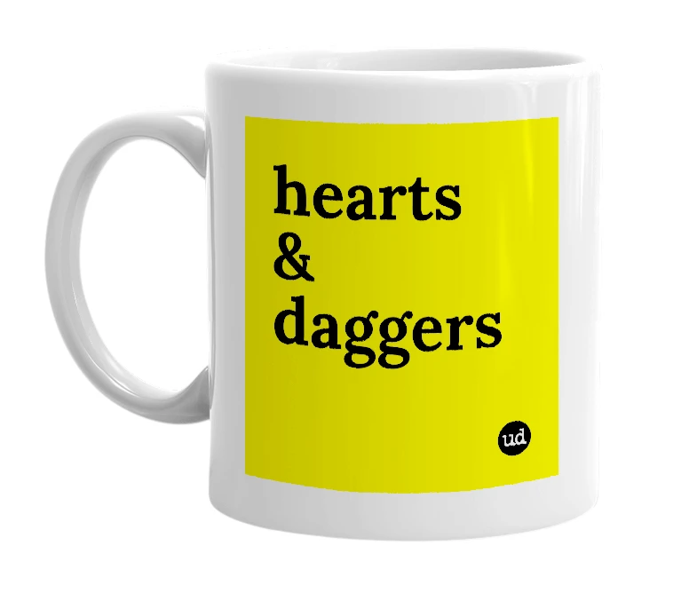 White mug with 'hearts & daggers' in bold black letters