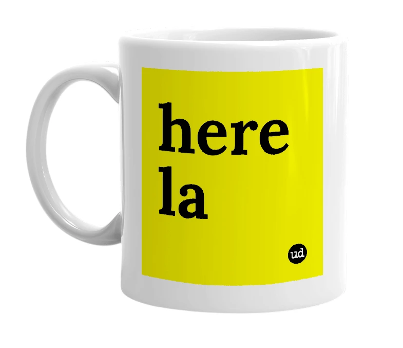 White mug with 'here la' in bold black letters