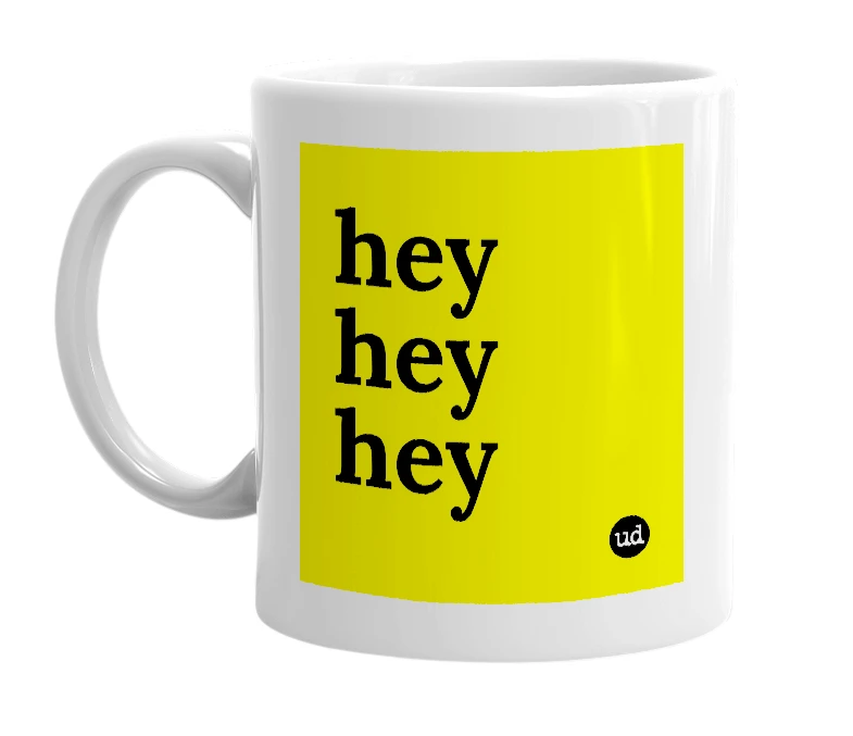 White mug with 'hey hey hey' in bold black letters